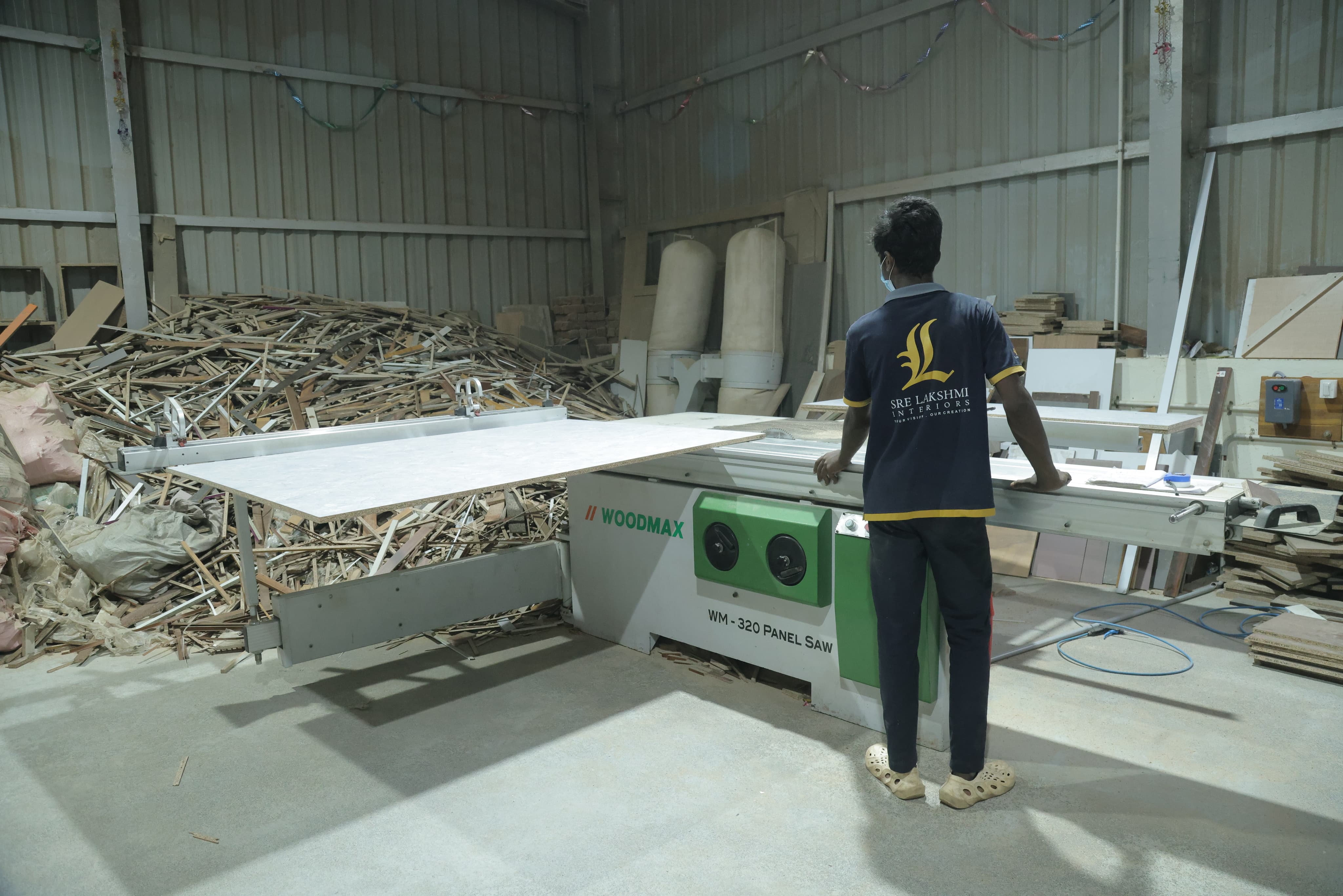 Operator cutting furniture panels using Woodmax panel saw